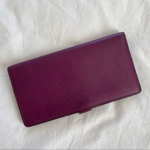 Coach checkbook cover.